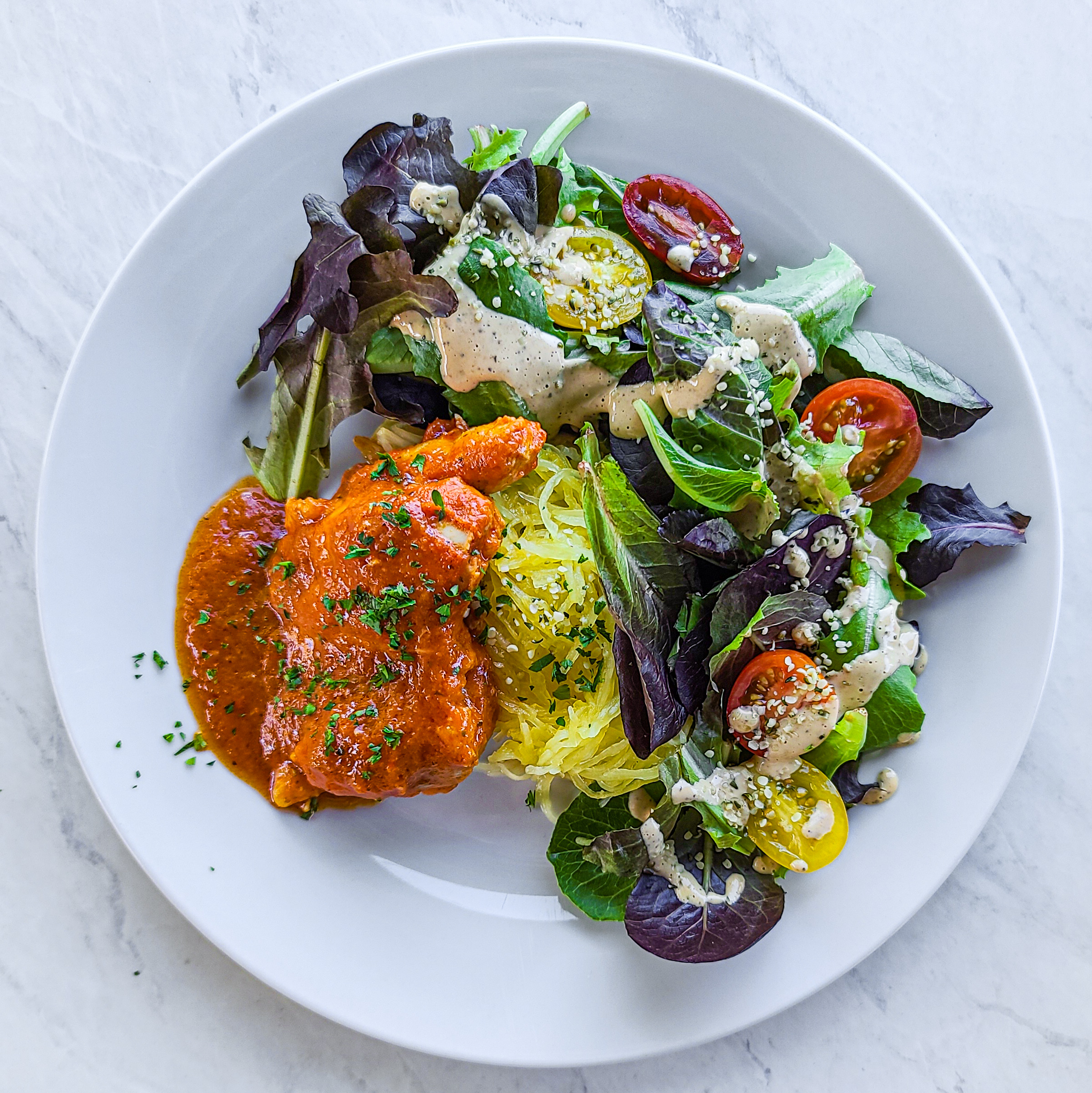 Tomato Braised Chicken Thighs with Spaghetti Squash & Baby Green salad with Nut Butter Vinaigrette