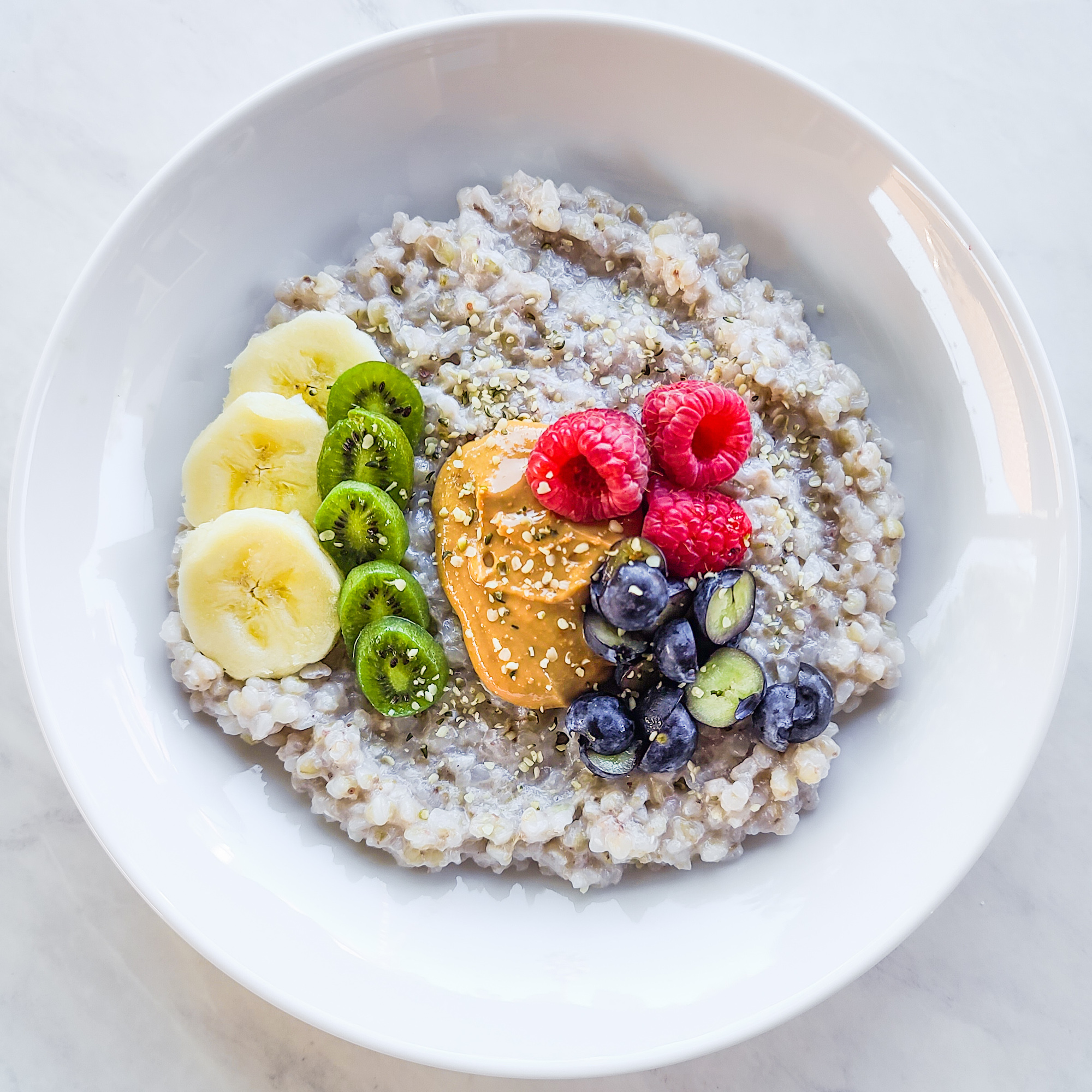 Warm Buckwheat Breakfast Bowl with Fruit and Nut Butter