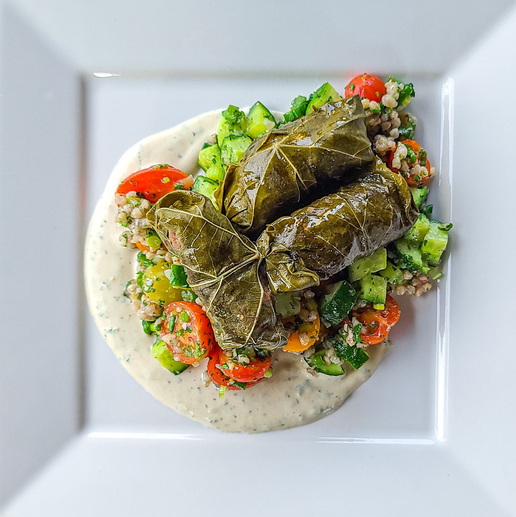 Stuffed Grape Leaves with Cucumber Tomato Buckwheat & Yogurt Tahini Dressing