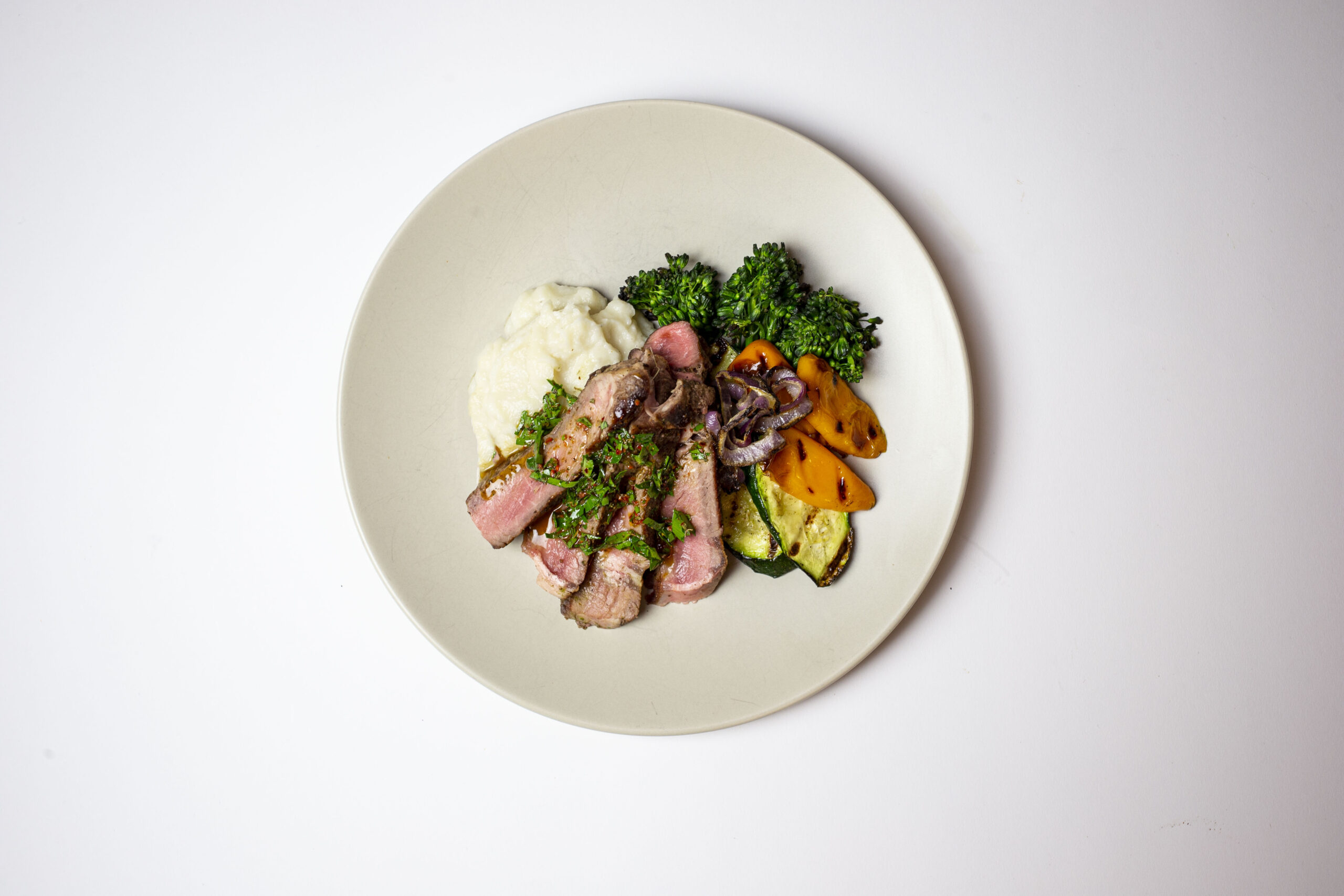 Seared Ribeye with Chimmichurri, Cauliflower Mash, & Grilled Vegetables