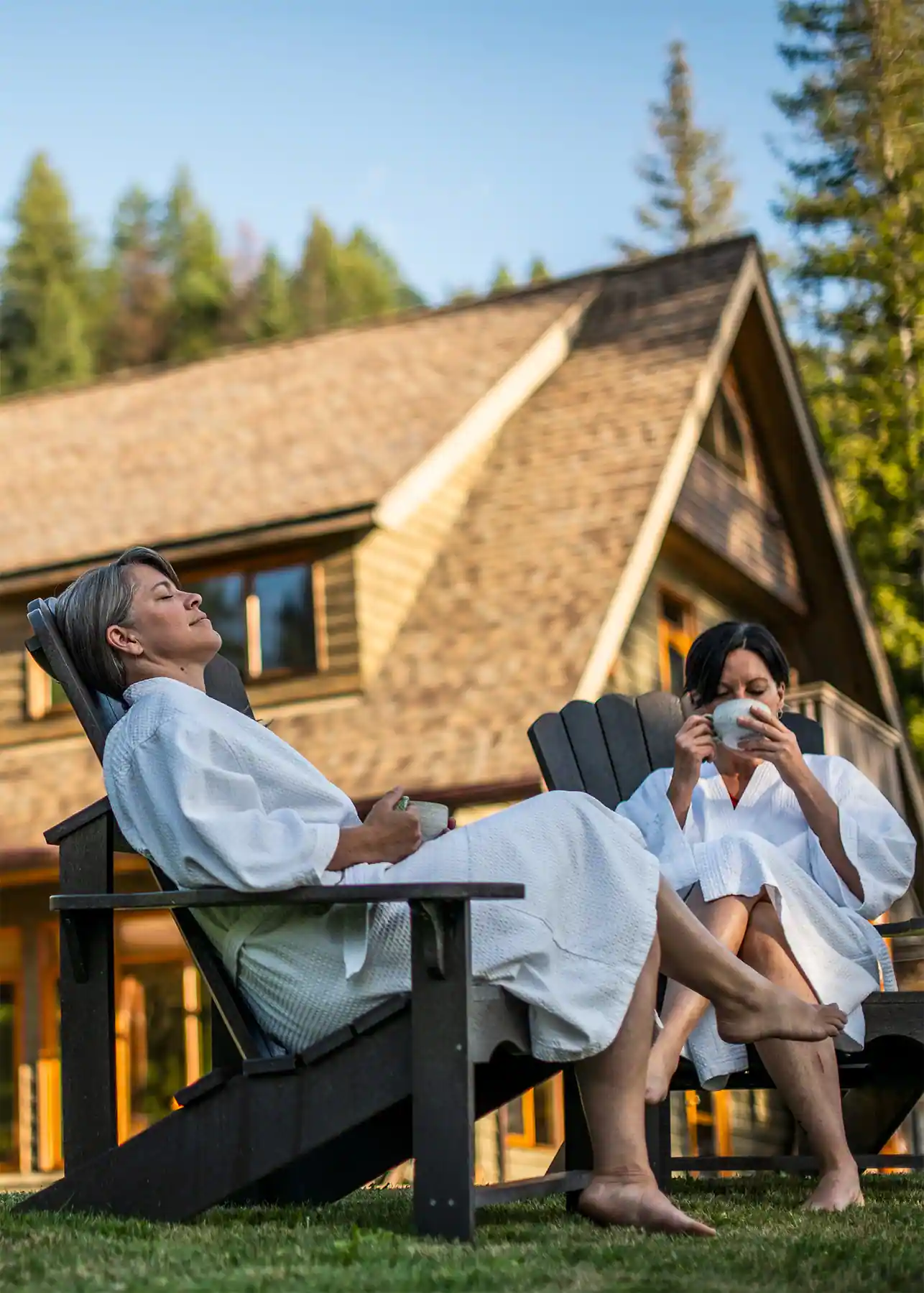 Mountain Trek Health Retreat guests sitting in lawn chairs in front of the lodge