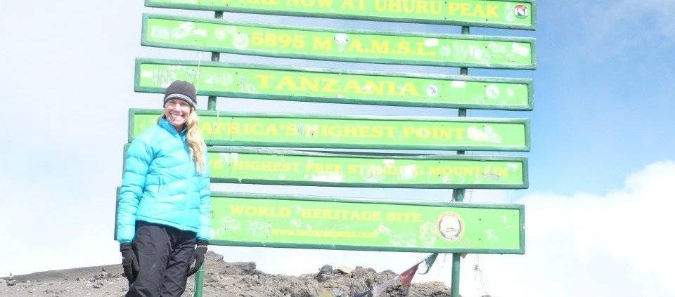 Alison Simpson, Mountain Trek Alum, at the peak of Kilimanjaro