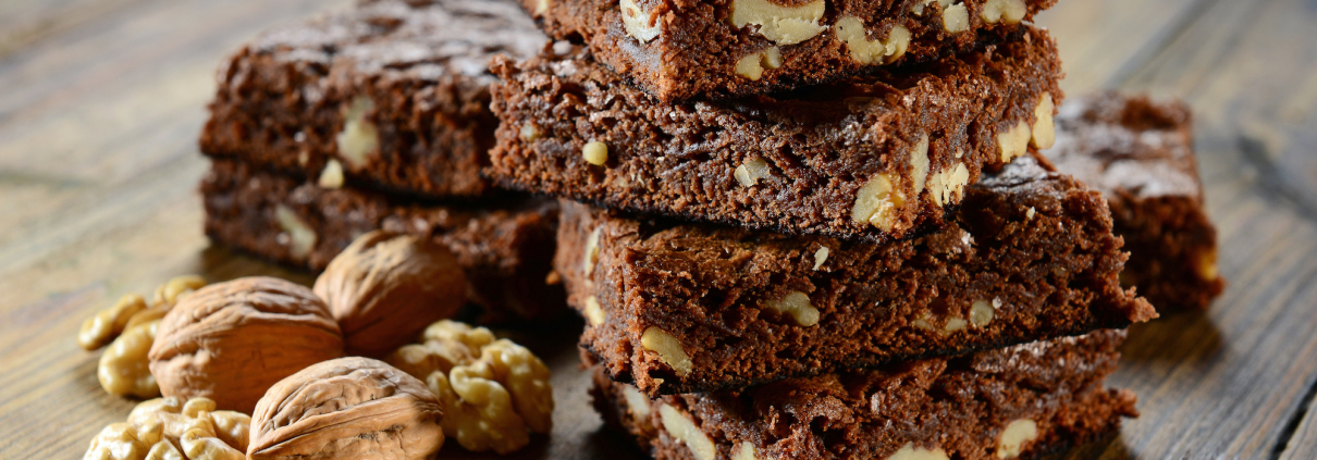 black bean brownies stacked with a walnut