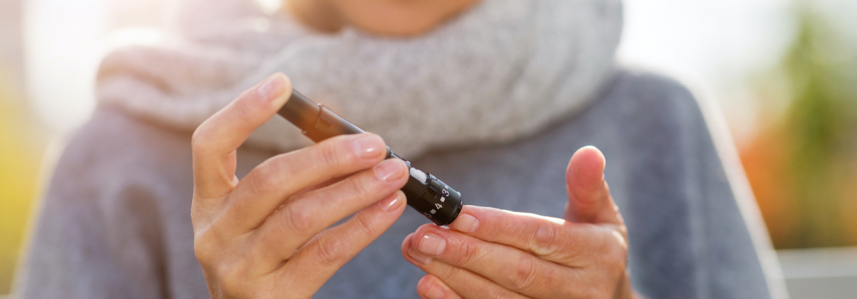 older woman with diabetes checking blood sugar levels