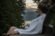 Guest in Robe Relaxing at Mountain Trek Health Reset Retreat overlooking Mountains and lake